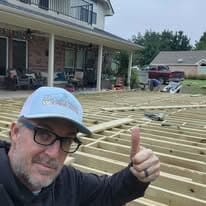 JT giving a thumbs-up over the finished deck framing