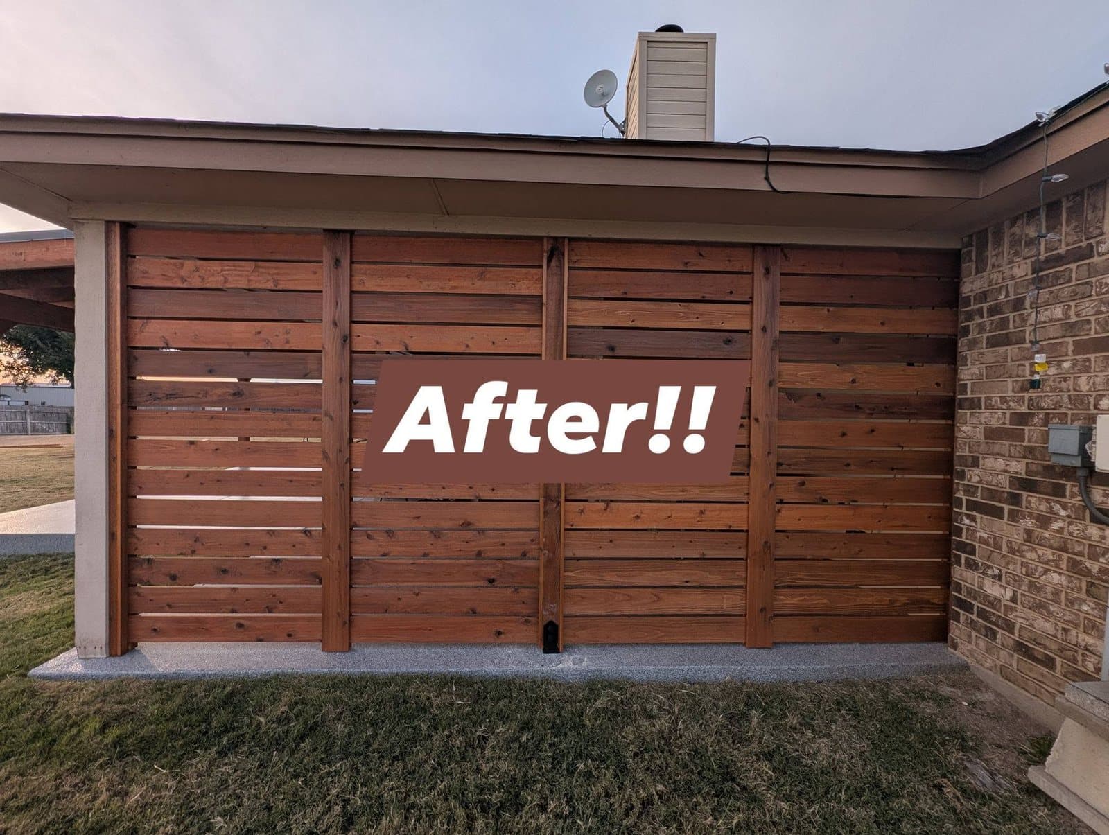 The same covered patio after, closed in with a stained horizontal cedar slat screen